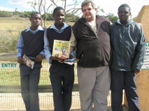 Phillip with the children and Doreen's book