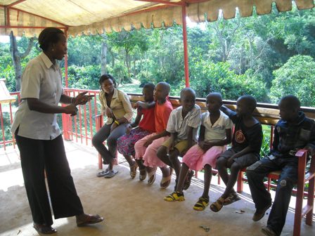 Helen and the children learning about Matoke